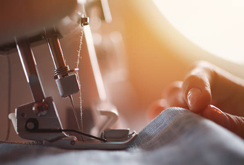 Sewing machine stitching fabric